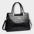 Olivia - Bolso de mano con acabado brillante en estampado de cocodrilo