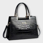 Olivia - Bolso de mano con acabado brillante en estampado de cocodrilo