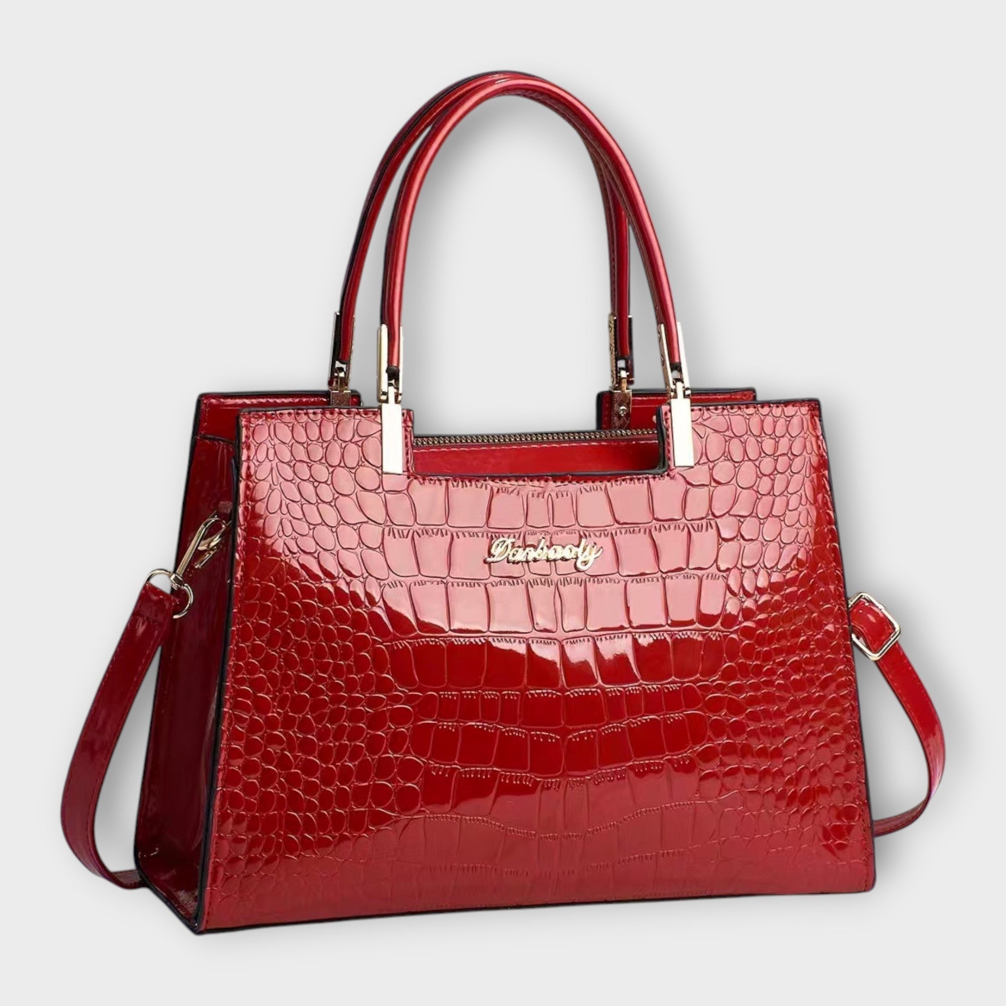 Olivia - Bolso de mano con acabado brillante en estampado de cocodrilo