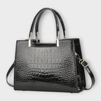 Olivia - Bolso de mano con acabado brillante en estampado de cocodrilo